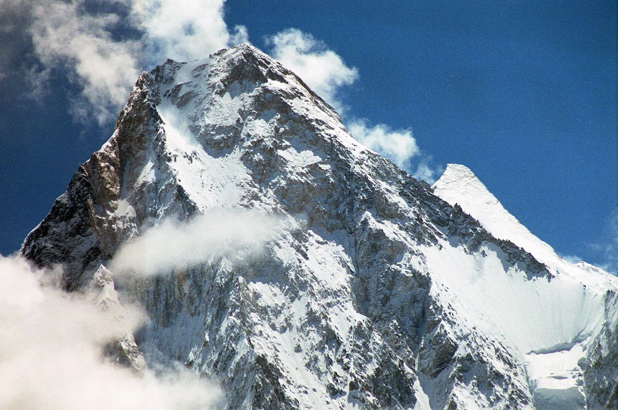 33 Gasherbrum IV And Gasherbrum II Close Up From Baltoro Glacier Between Goro II and Concordia Gasherbrum IV would probably be a more popular climbing mountain if it was 75m taller. At 7925m, it is the 17th highest mountain in the world. Gasherbrum II (G2, 8035m) pokes out to the right of Gasherbrum IV. On June 22, 1986 Greg Child, Tim Mcartney-Snape, and Tom Hargis climbed to the North Summit and traversed 450m horizontally to the true Gasherbrum IV Summit, completing the first ascent of the Gasherbrum IV Northwest Ridge. �We functioned as a single being. Now on the summit, that being, drunk with euphoria, felt suddenly as if it had been merged with sky and mountain as well to become a single, elemental entity.� - Thin Air: Encounters In The Himalaya by Greg Child.